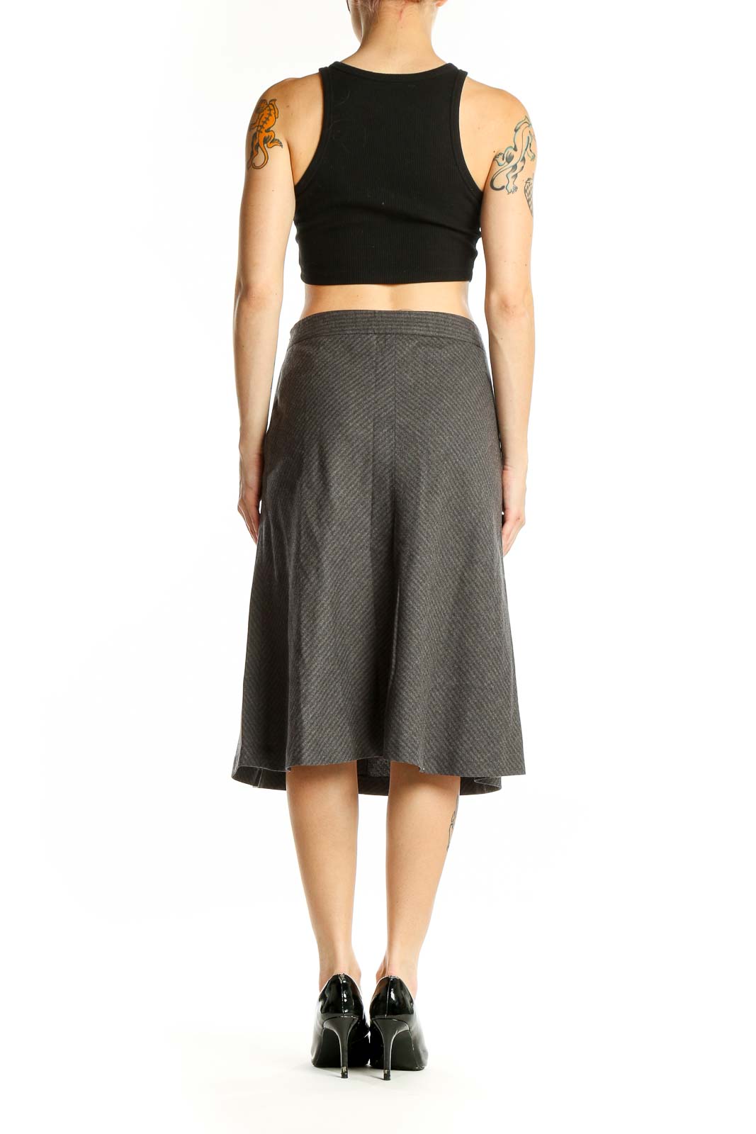 Side view of Theory gray wool blend A-line skirt paired with black top