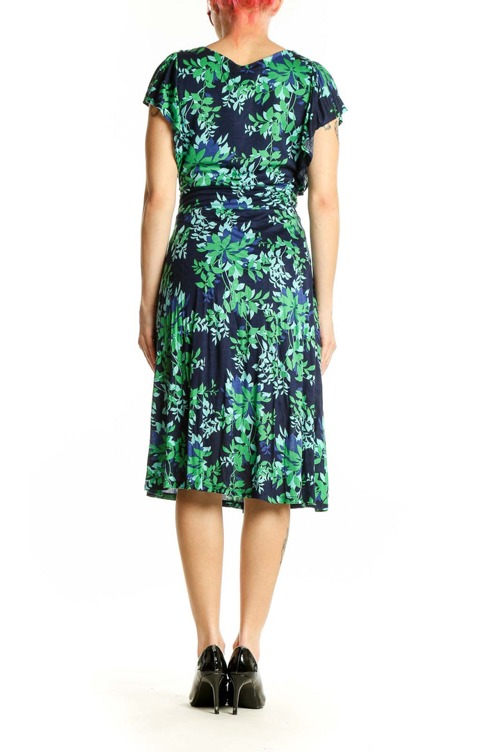 Side view of Boden navy floral midi dress showing flutter sleeves and A-line skirt