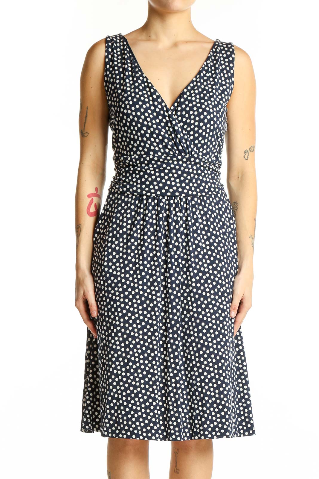 Front view of Boden navy polka dot sleeveless wrap dress