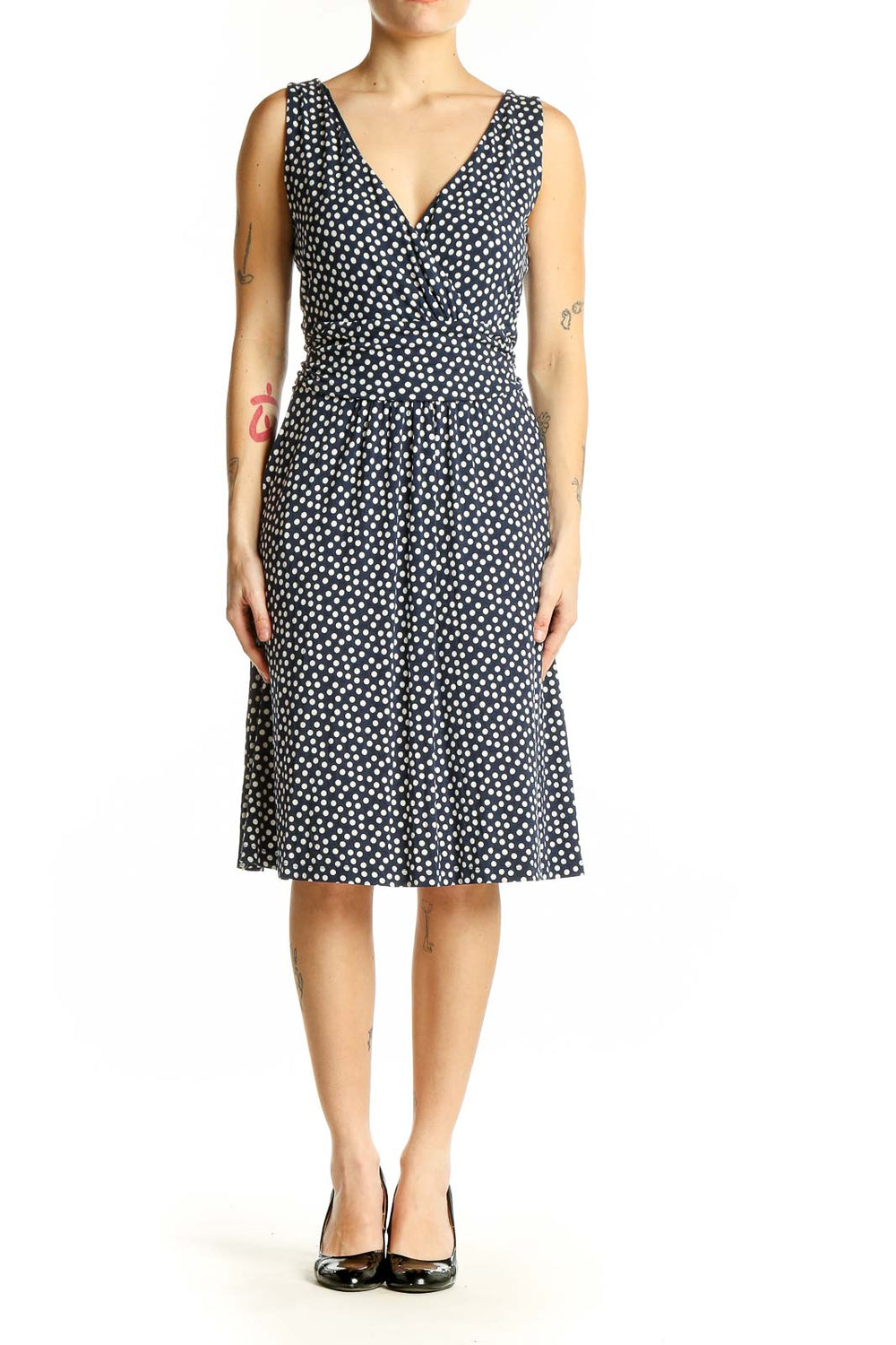 Front view of Boden navy polka dot sleeveless wrap dress