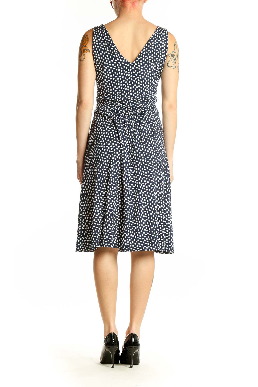 Side view of Boden navy polka dot sleeveless wrap dress with pockets