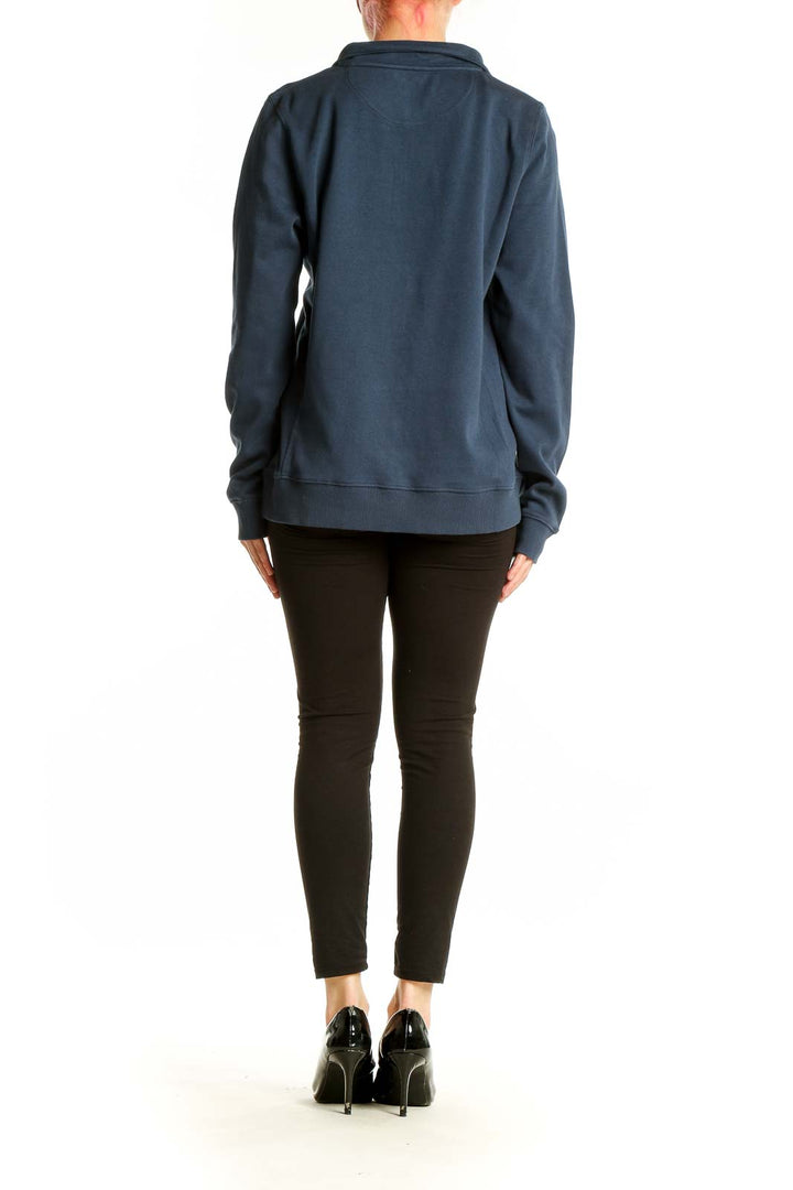 Side view of navy vineyard vines cotton quarter-zip pullover on model