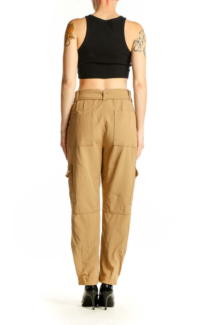 Side view of model wearing Banana Republic khaki cargo pants with black top