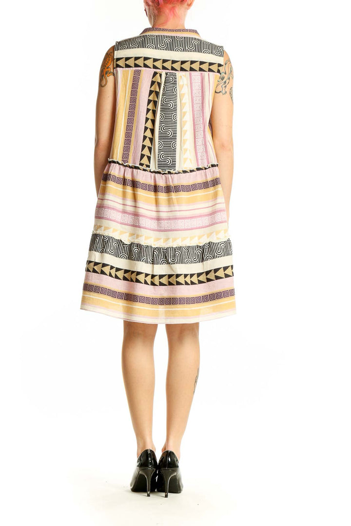 Side view of Elan Multicolor Geometric Print Sleeveless Dress showing high-low hemline