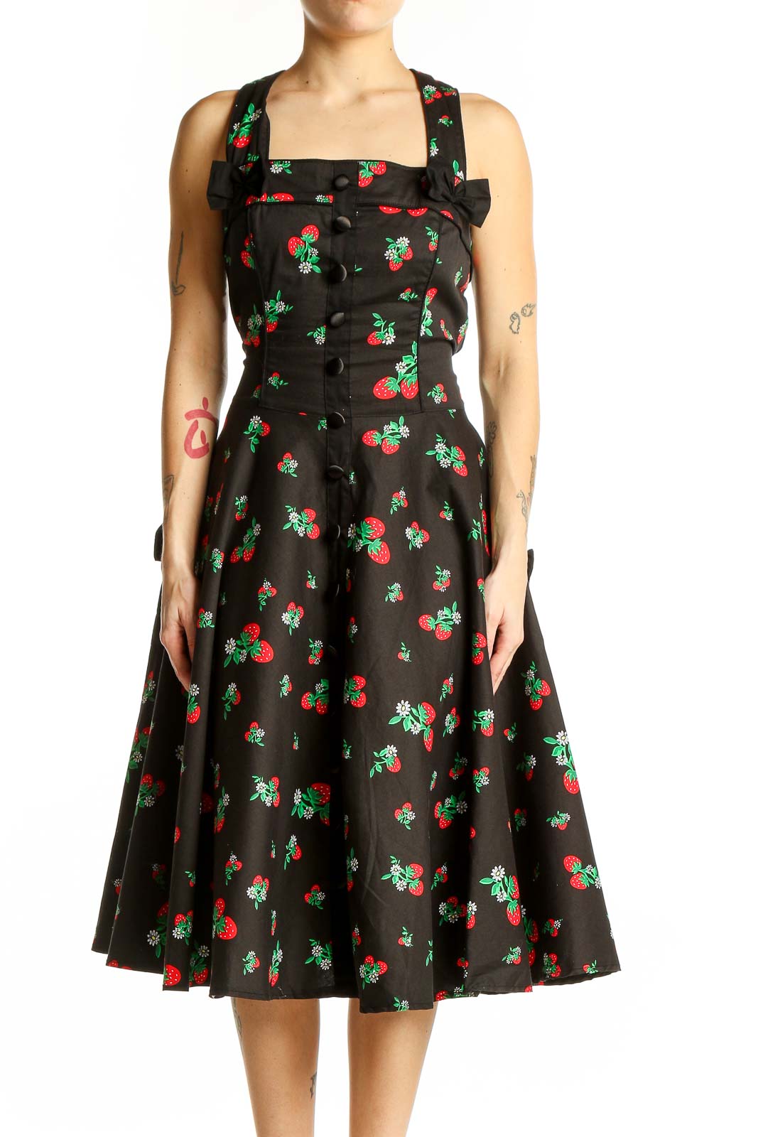 Front view of Hell Bunny black cherry print swing dress with square neckline and bow detail