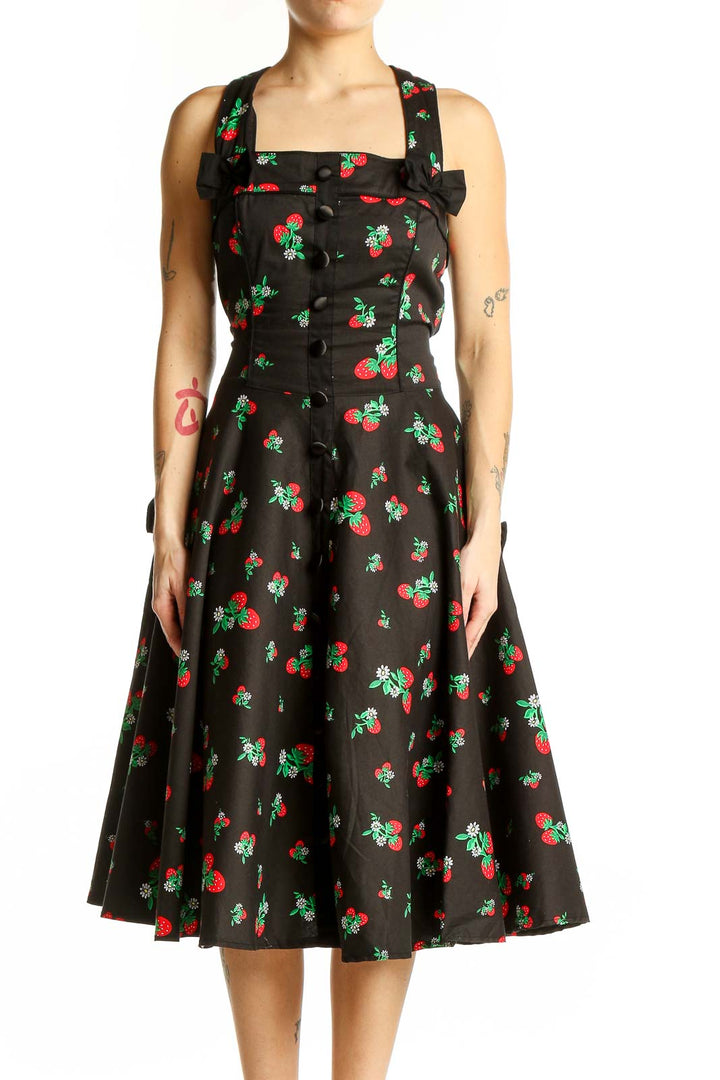 Front view of Hell Bunny black cherry print swing dress with square neckline and bow detail