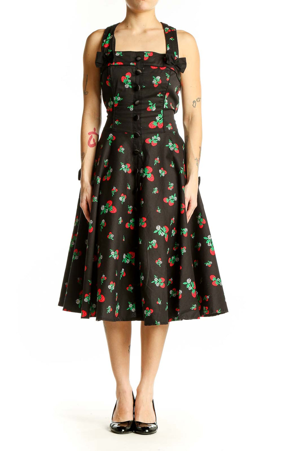 Front view of Hell Bunny black cherry print swing dress with square neckline and bow detail