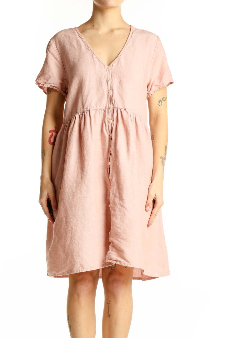 Front view of Madewell blush pink V-neck midi dress with button-down front