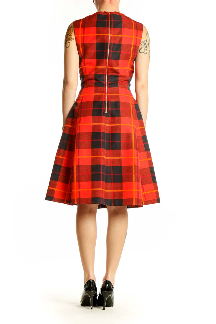 Side view of Kate Spade red plaid sleeveless dress showing pleated skirt