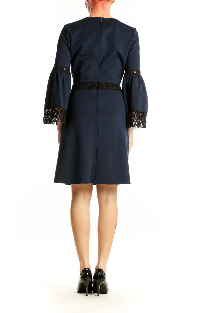 Side view of Kobi Halperin navy cocktail dress showing bell sleeve detail