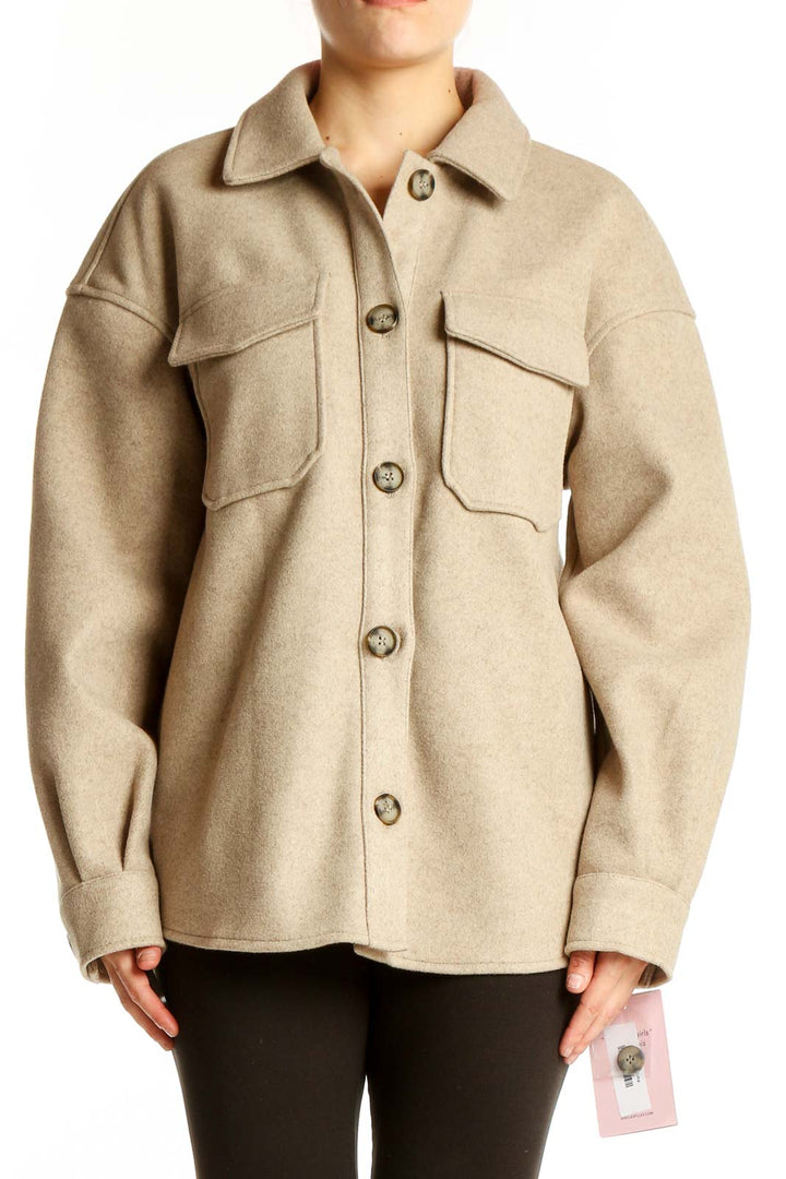 Front view of beige oversized button-up jacket by Avec Les Filles