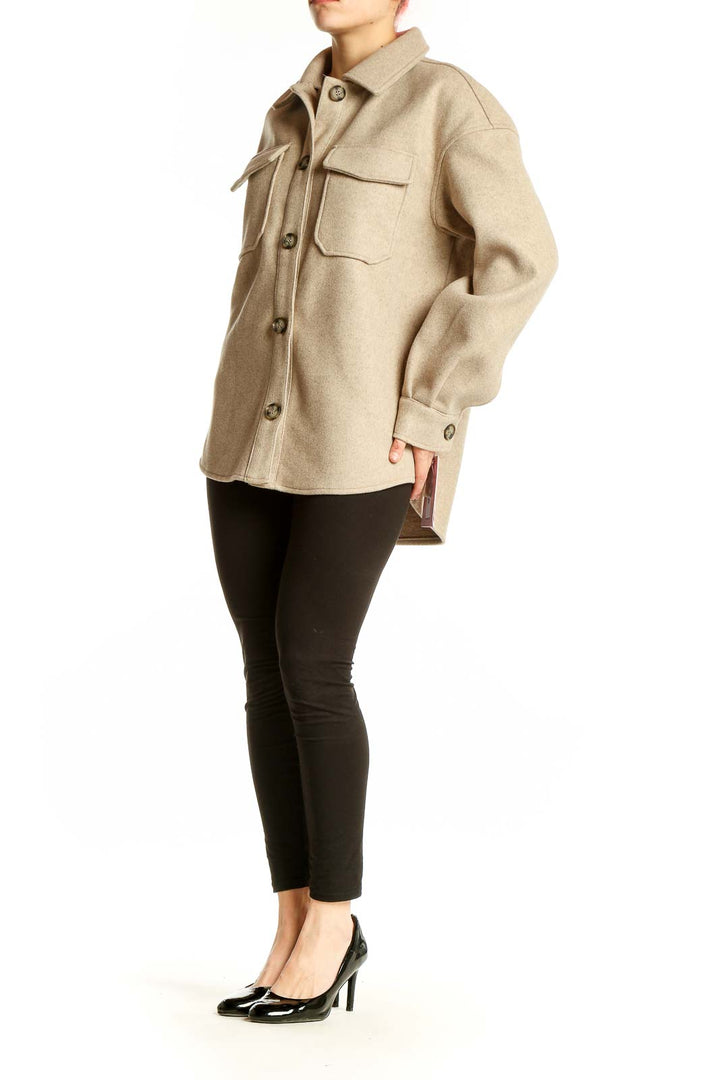 Front view of beige oversized button-up jacket by Avec Les Filles