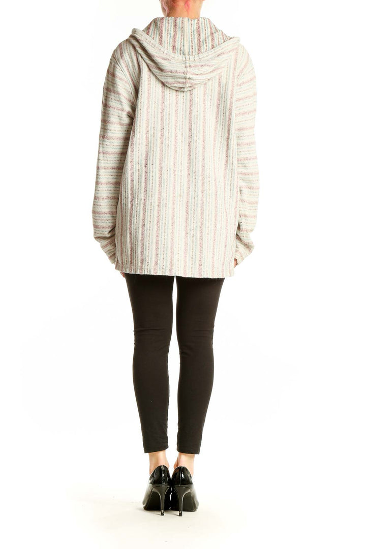 Side view of model wearing cream striped hooded knit sweater from Lucky Brand