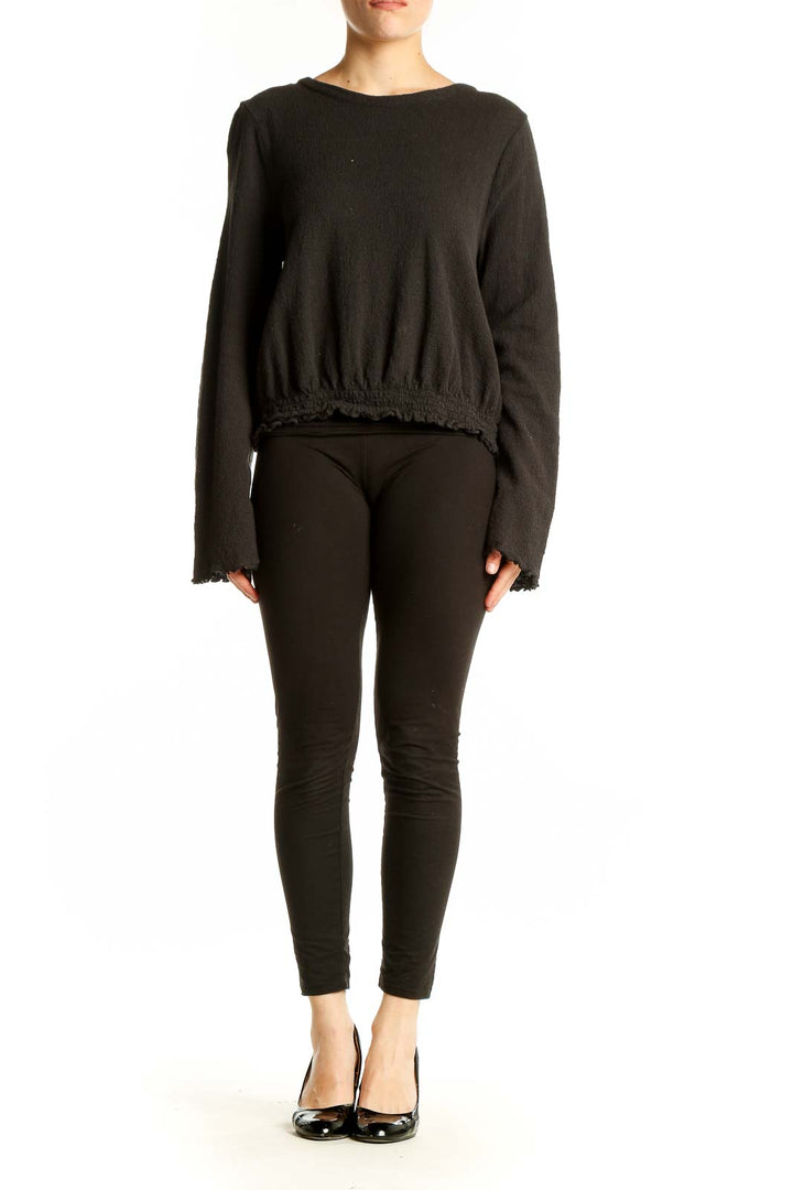 Front view of Madewell black cotton cropped long sleeve top with gathered hem