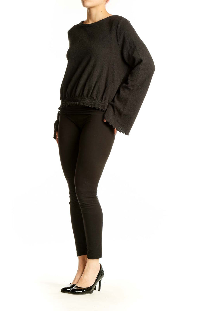 Front view of Madewell black cotton cropped long sleeve top with gathered hem