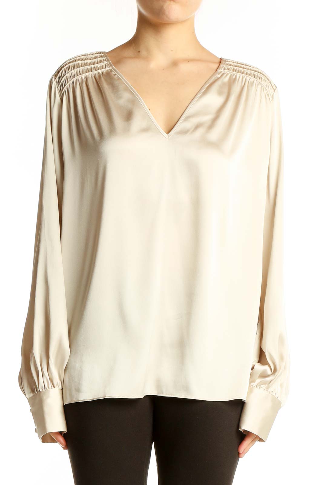 Front view of cream V-neck blouse with gathered shoulders