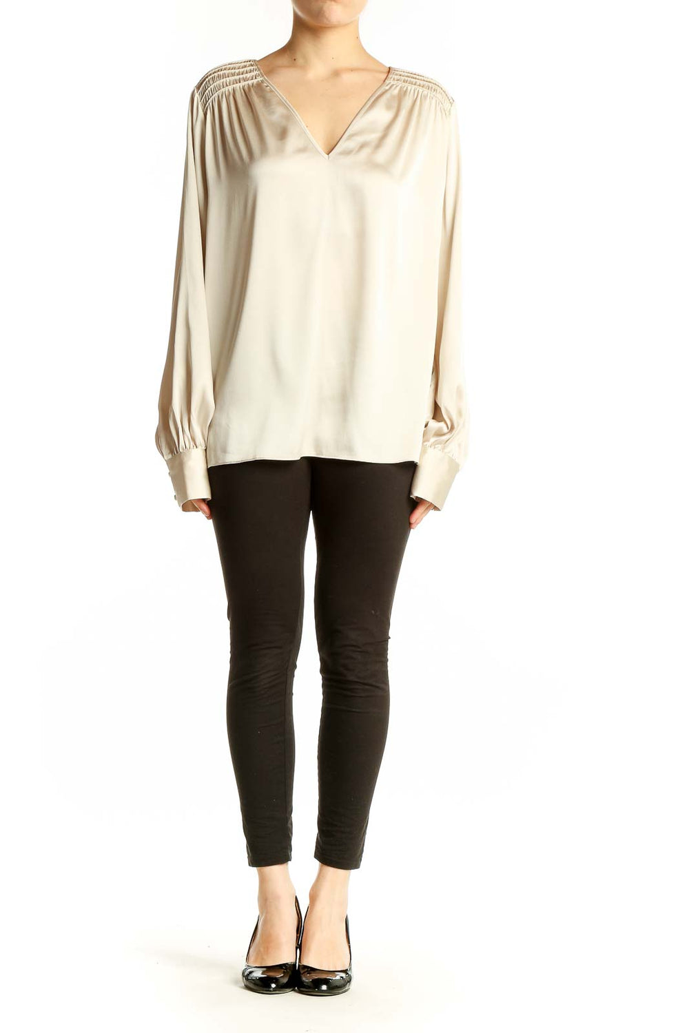 Front view of cream V-neck blouse with gathered shoulders