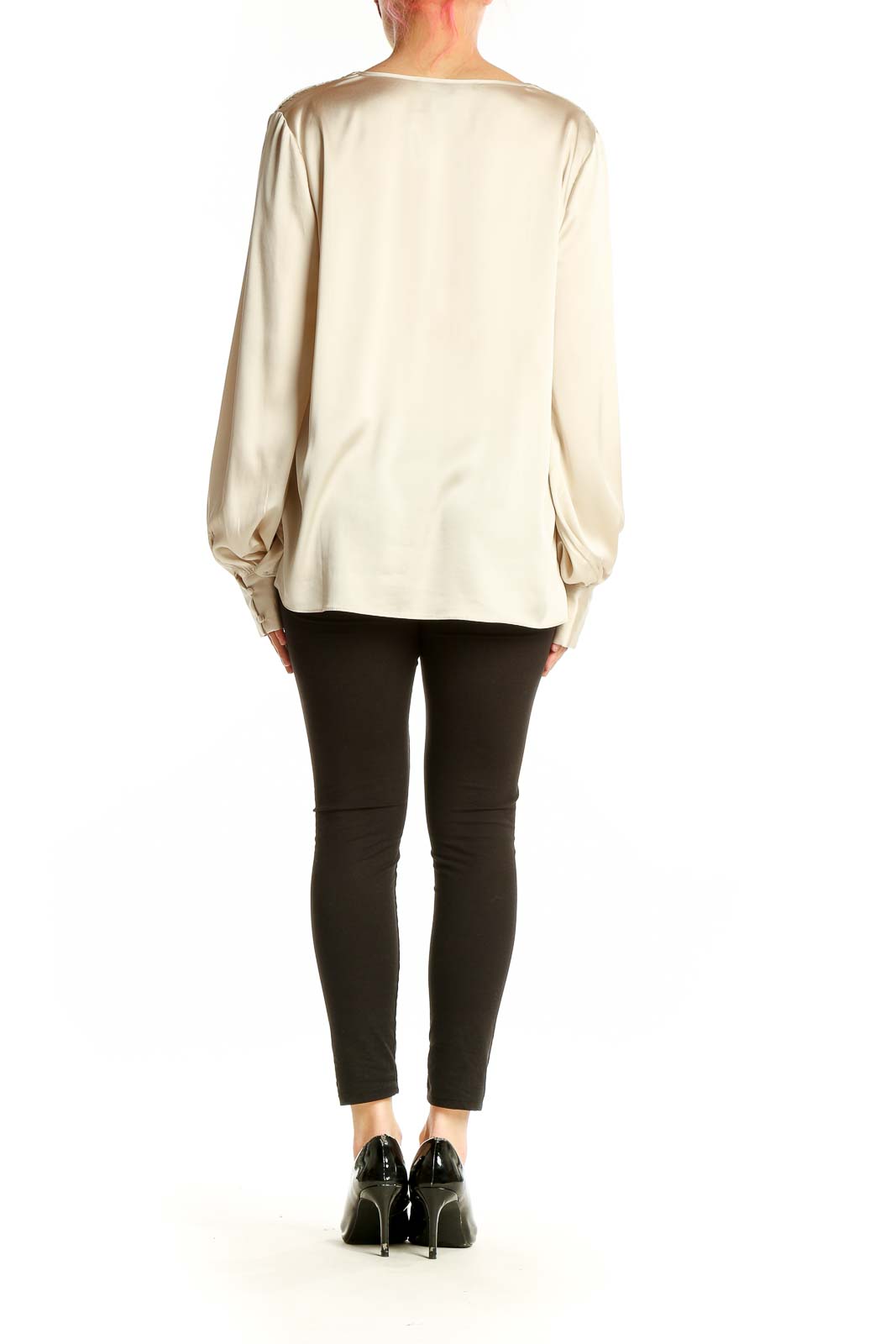 Back view of cream blouse showing flowing silhouette