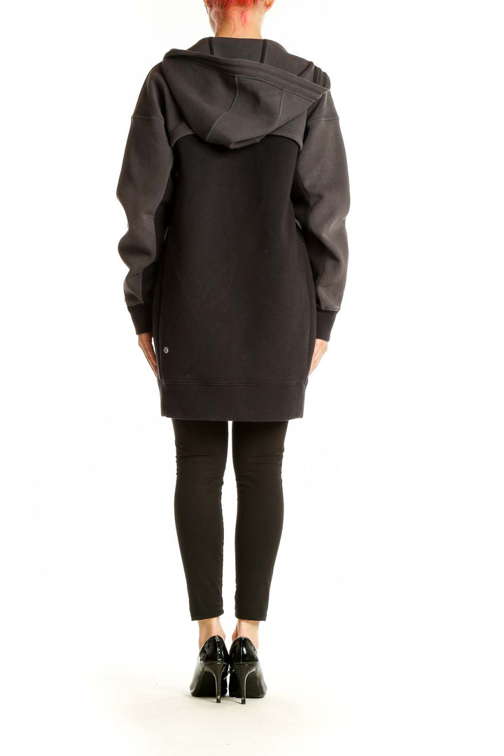 Side view of gray Lululemon oversized hooded zip-up jacket on model