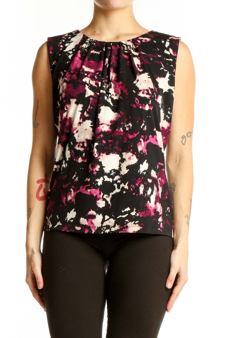 Front view of Calvin Klein sleeveless top with black, pink, and white abstract print