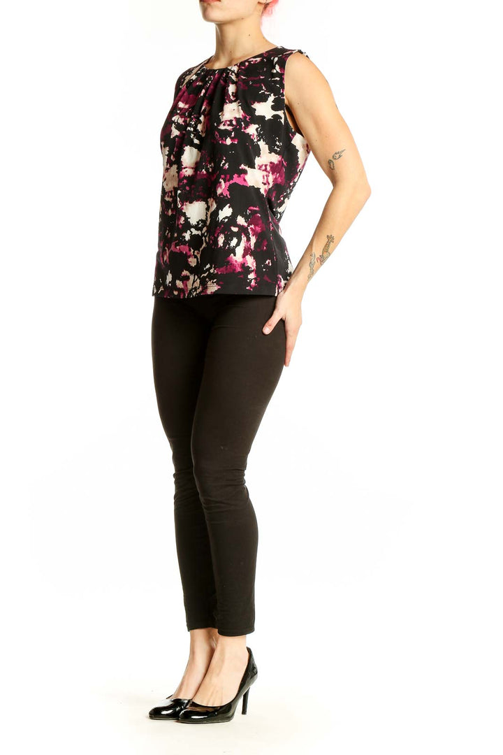 Front view of Calvin Klein sleeveless top with black, pink, and white abstract print