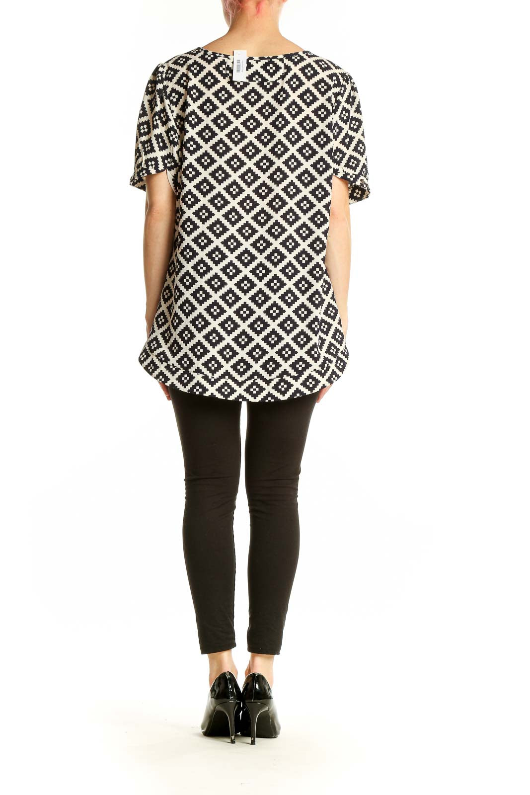 Side view of 41 Hawthorn Black and White Geometric Print Tunic Top on model