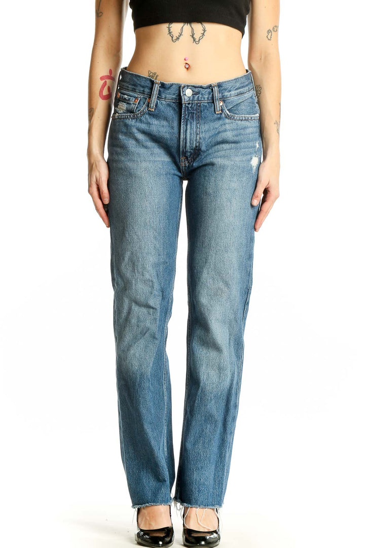 Front view of Gap blue straight leg jeans with distressed details