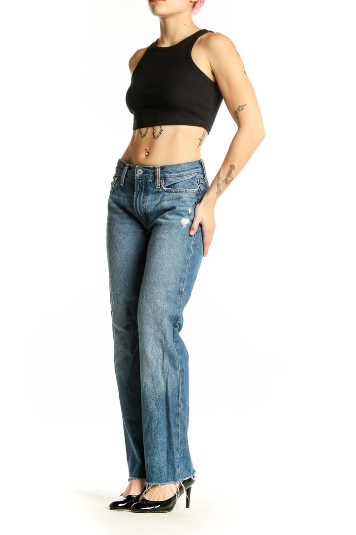 Front view of Gap blue straight leg jeans with distressed details