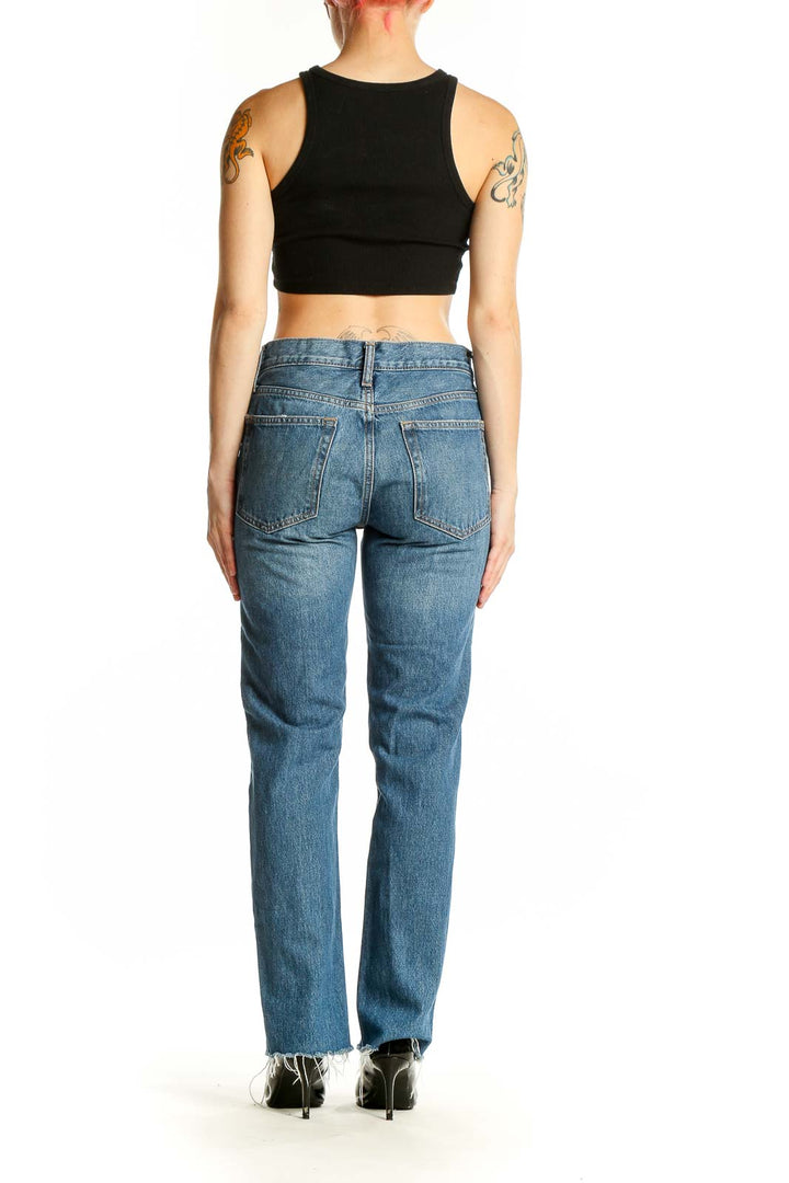 Back view of Gap blue straight leg jeans on model with black crop top