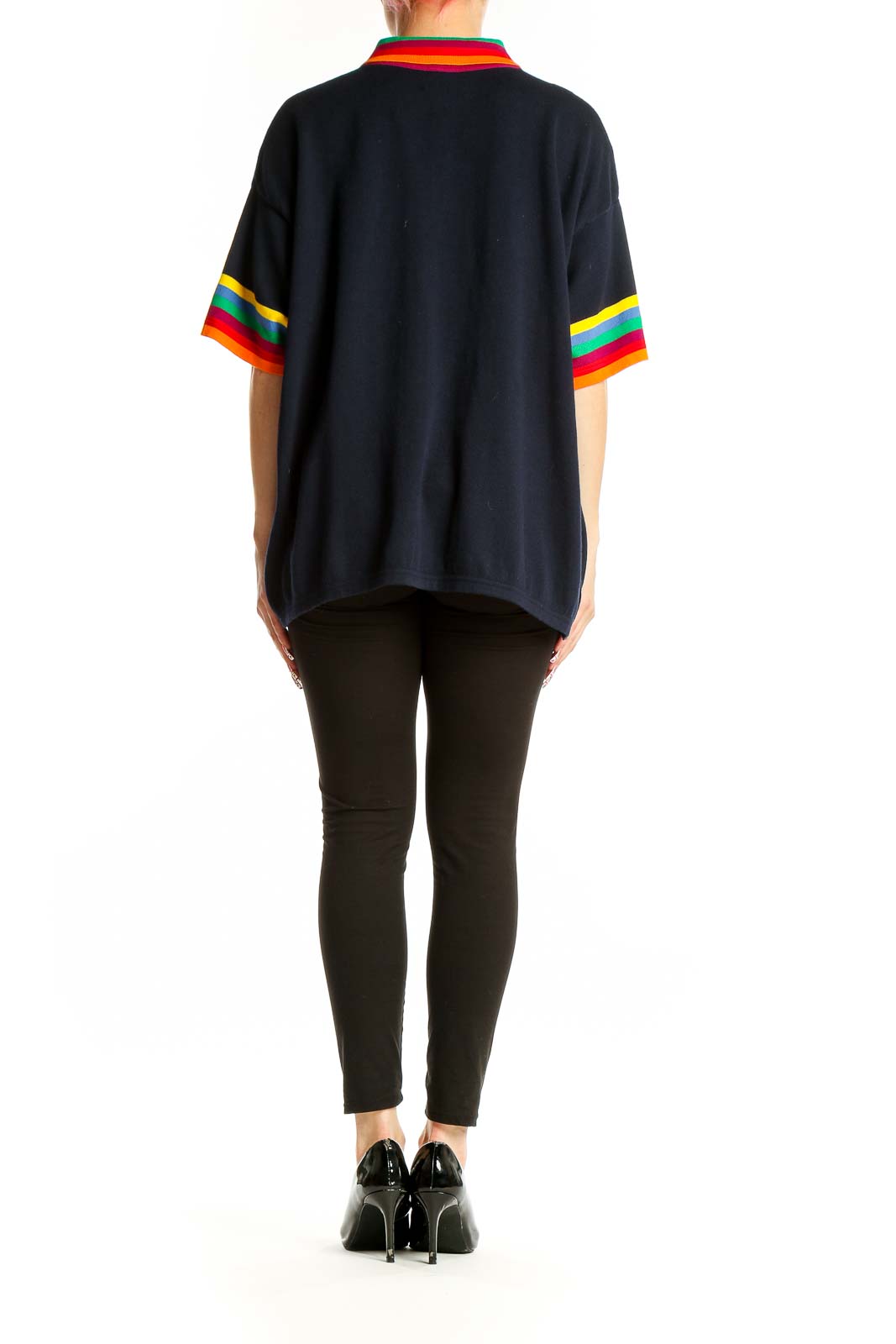Side view of oversized black United Colors of Benetton top with rainbow-striped cuffs