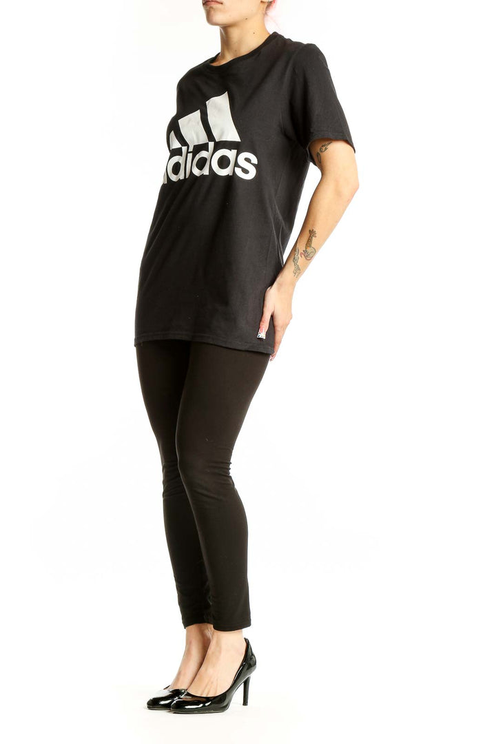 Front view of black Adidas cotton t-shirt with white logo
