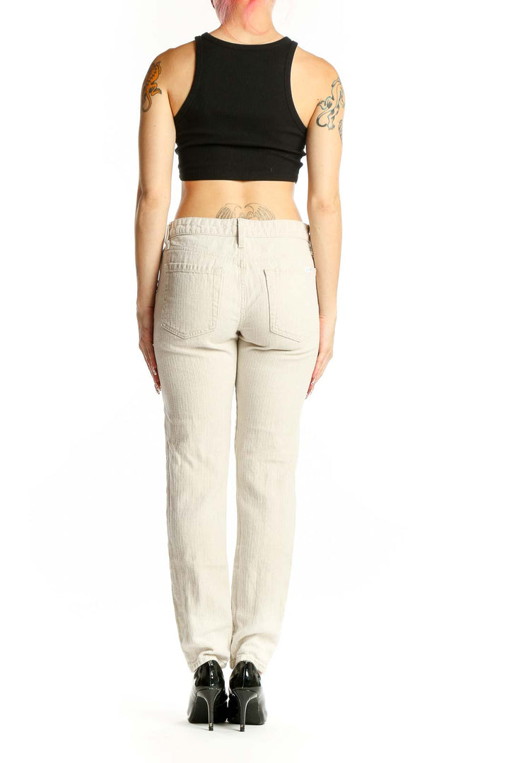 Back view of Joe's beige straight leg pants on model with black crop top