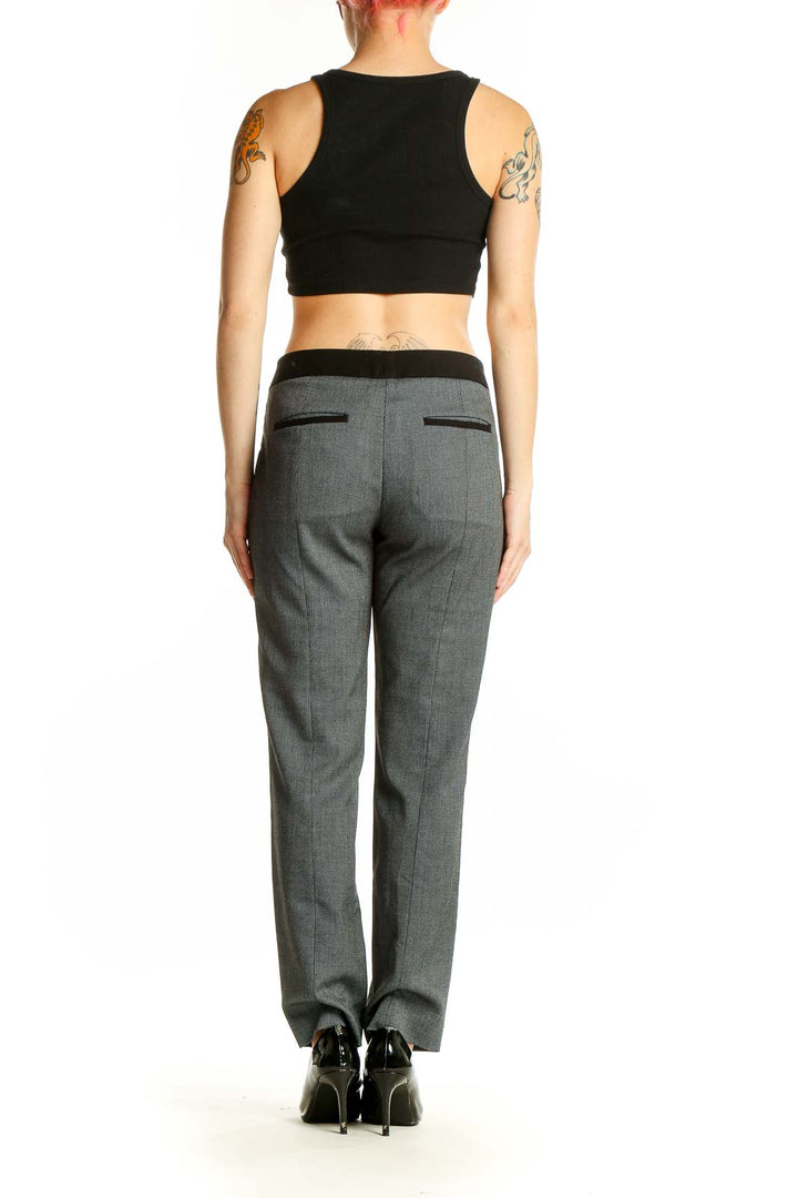 Back view of Express gray straight-leg dress pants on model with black crop top