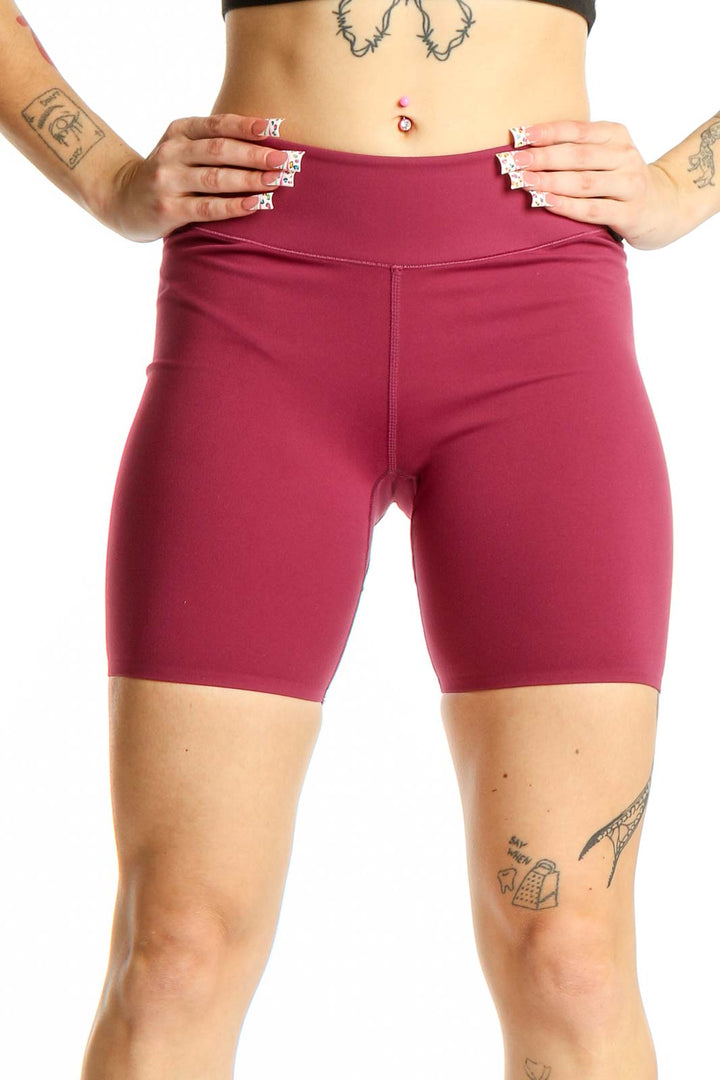 Front view of burgundy high-waisted compression shorts from Uniqlo
