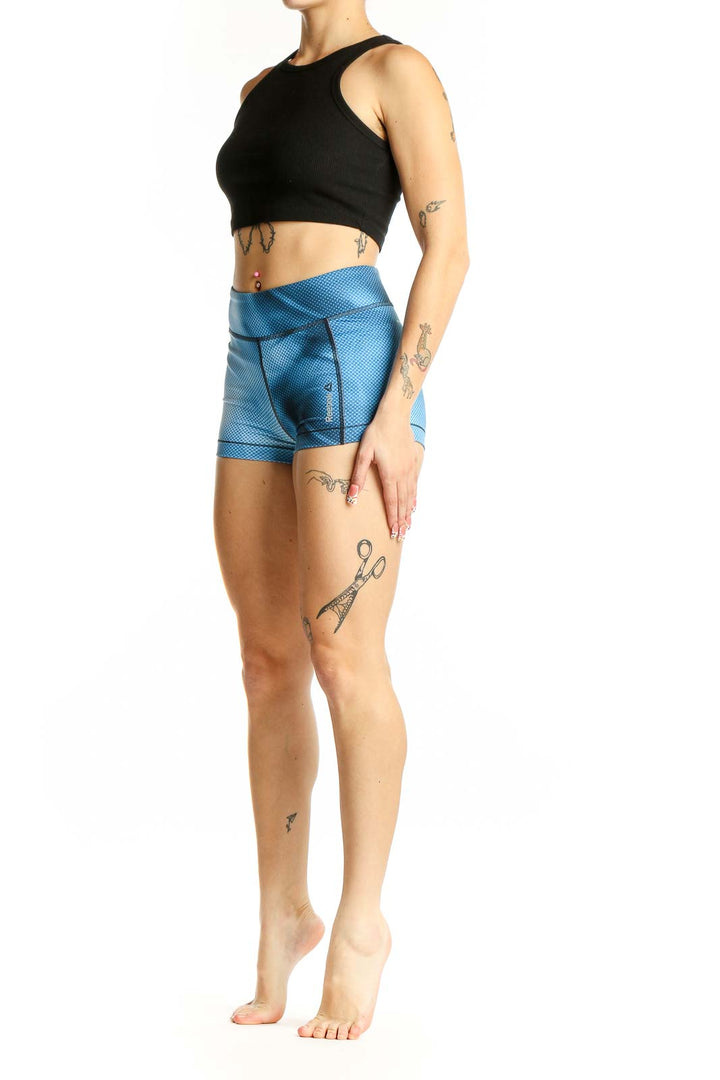 Front view of blue textured Reebok high-waist athletic shorts