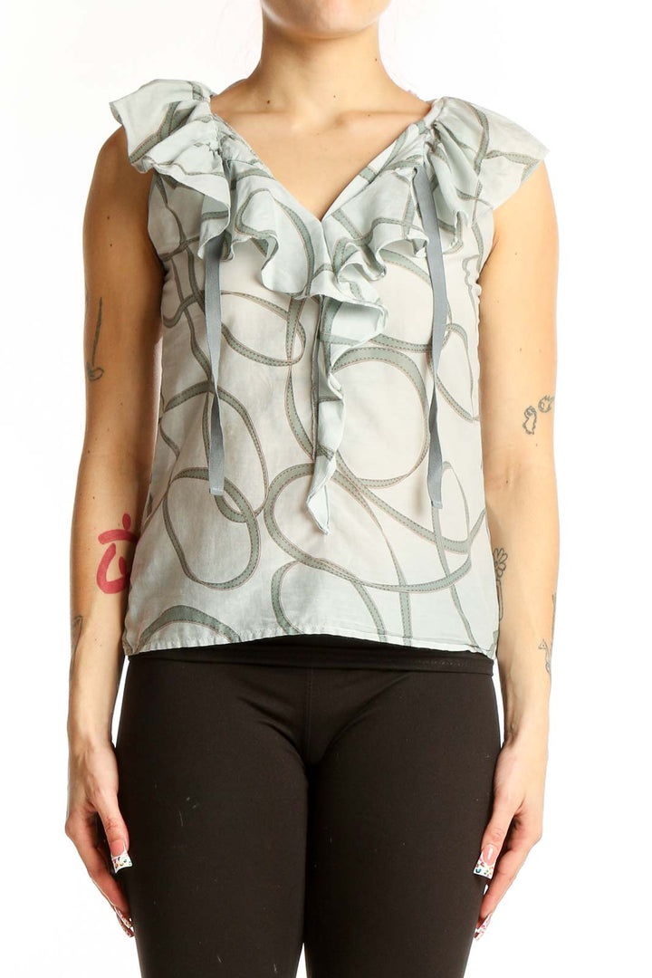 Front view of Ann Taylor LOFT light gray sleeveless blouse with ruffled V-neck and swirl pattern