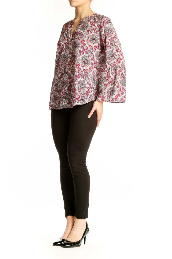 Front view of J.Crew pink floral paisley blouse with bell sleeves