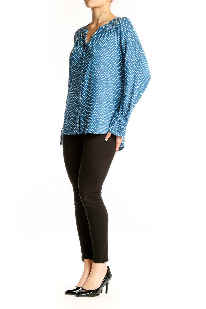 Front view of Boden blue polka dot viscose blouse with v-neckline