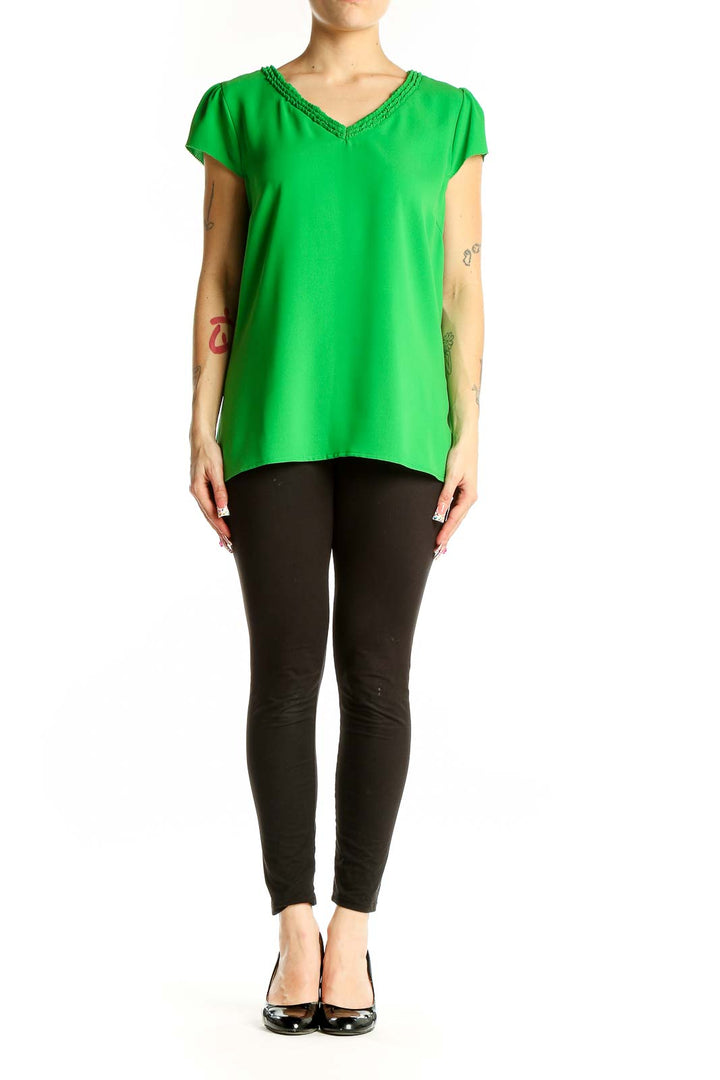 Front view of green V-neck cap sleeve blouse by Skies Are Blue