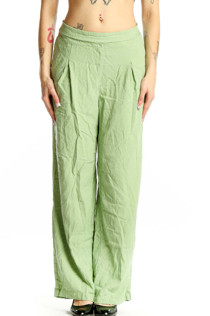 Front view of Vero Moda light green wide-leg pants with pleated waist