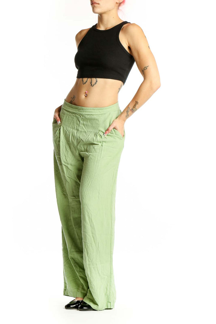 Front view of Vero Moda light green wide-leg pants with pleated waist