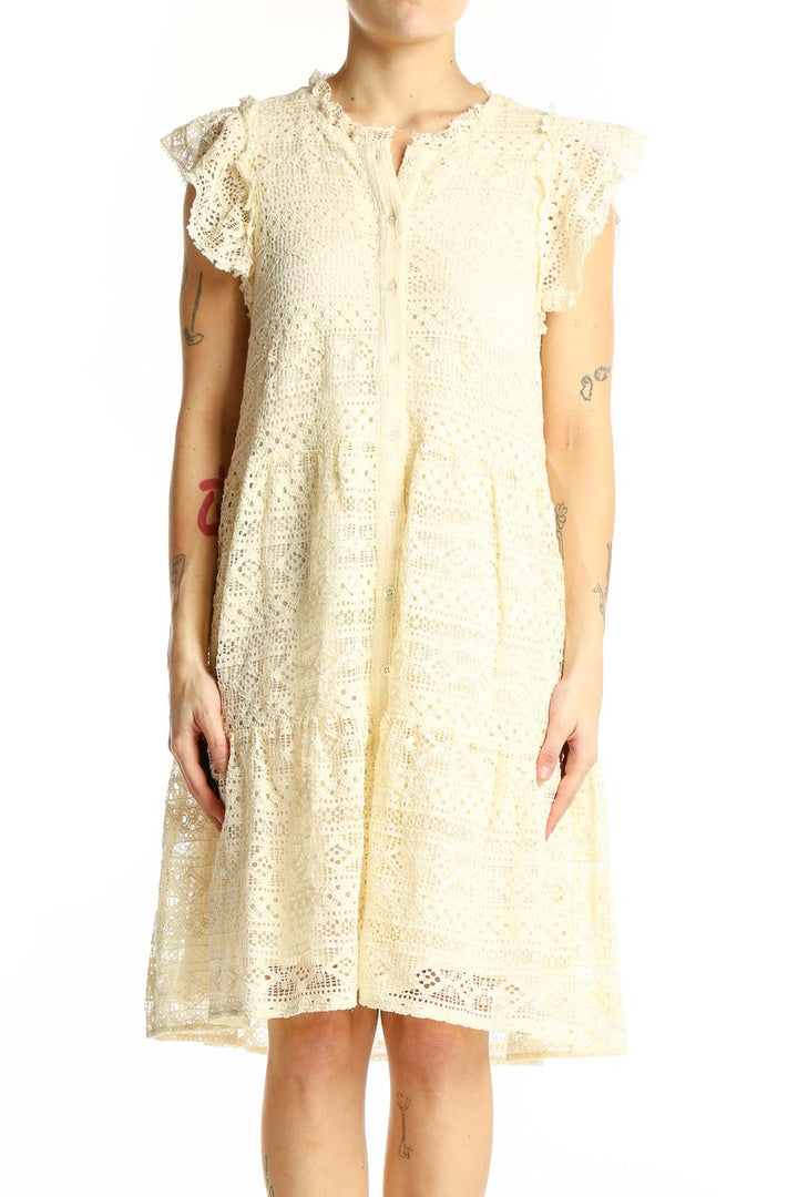 Front view of cream lace tiered midi dress with flutter sleeves