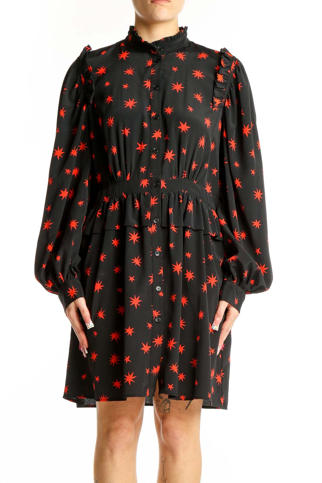 Front view of Topshop black mini dress with red star print and puff sleeves