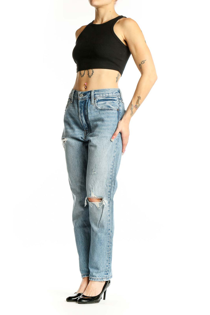 Front view of Levi's light blue distressed straight leg jeans