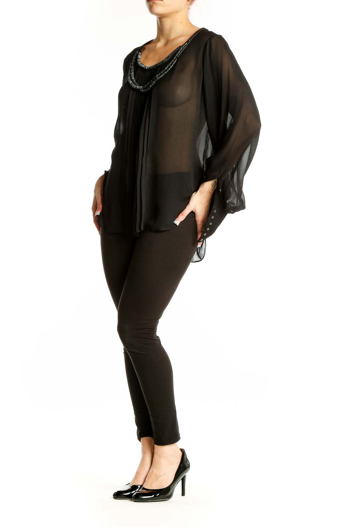 Front view of Elizabeth and James black sheer silk blouse with beaded neckline