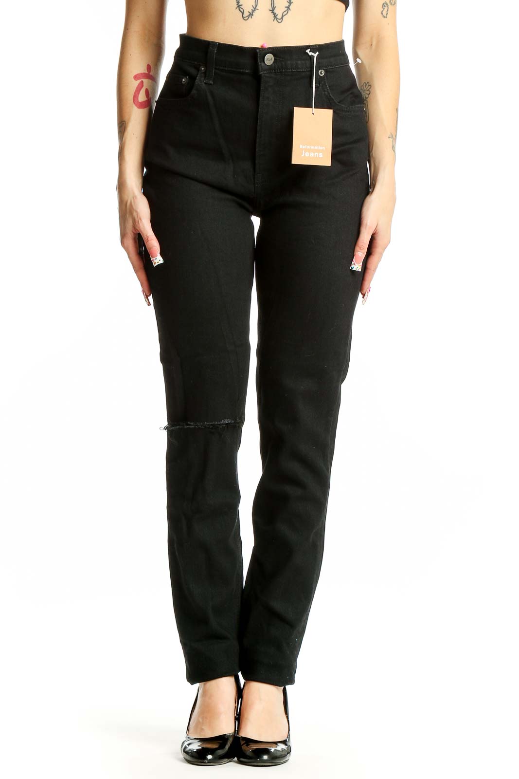 Front view of Reformation black high-waisted straight leg jeans with knee slit