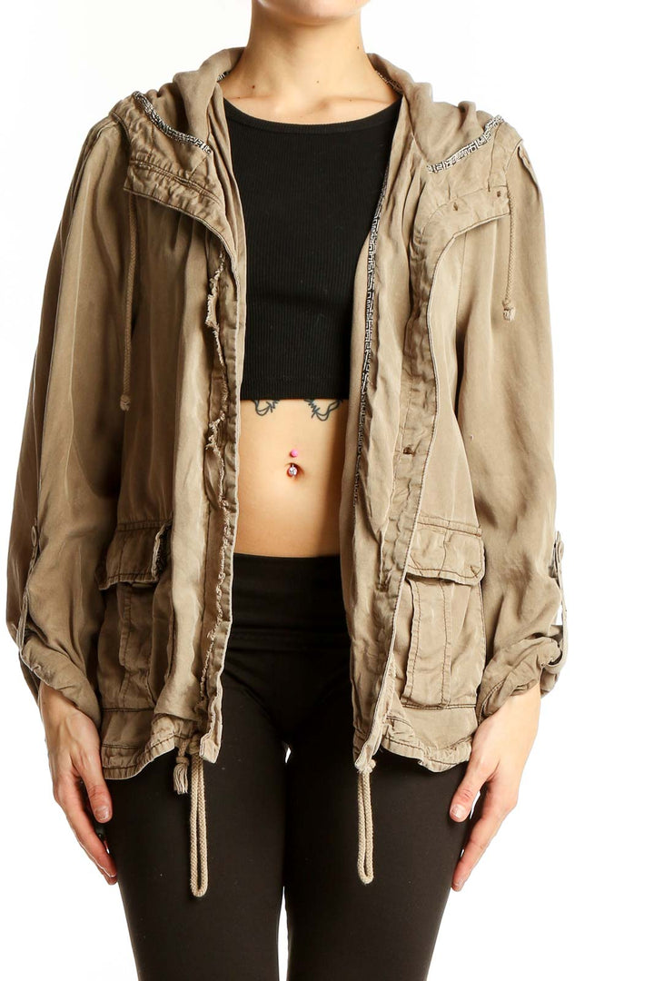 Front view of beige Tencel utility jacket with hood and pockets
