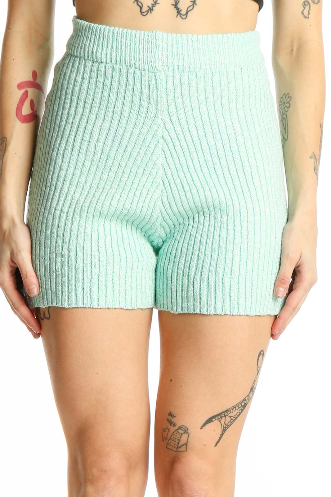 Front view of mint green ribbed knit high-waisted shorts