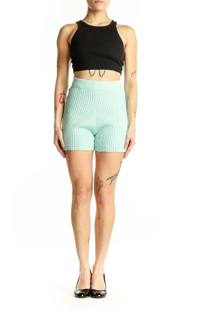 Front view of mint green ribbed knit high-waisted shorts