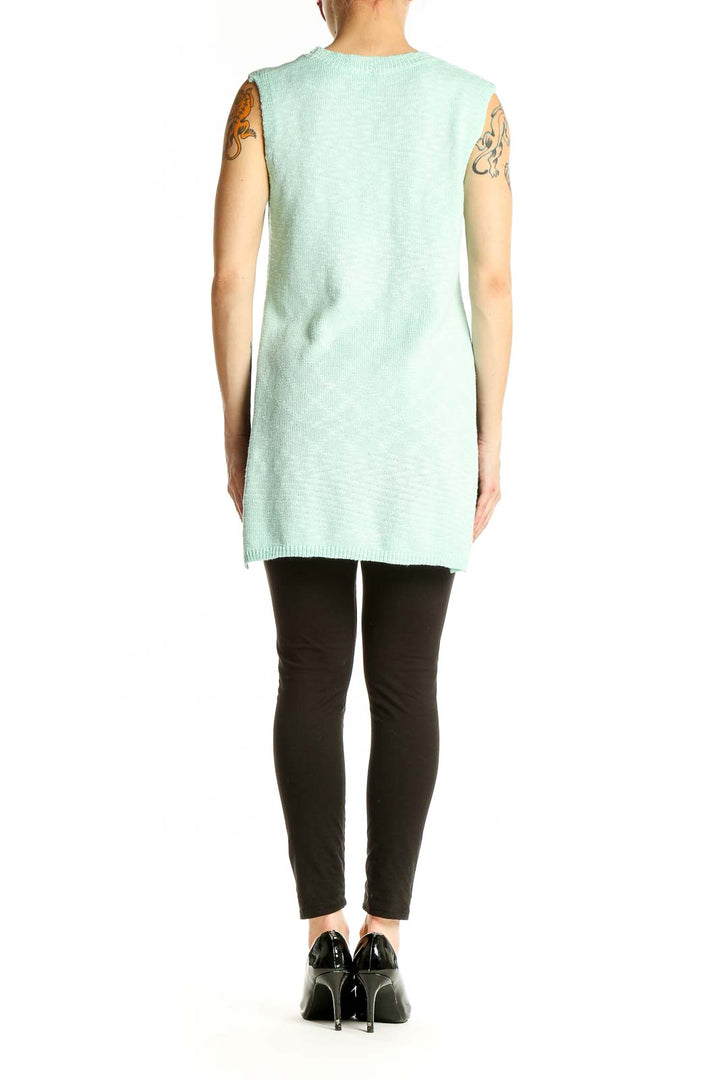 Side view of mint green sleeveless knit tunic from SilkRoll showing side slit
